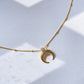 Crescent-shaped pendant necklace