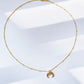 Crescent-shaped pendant necklace
